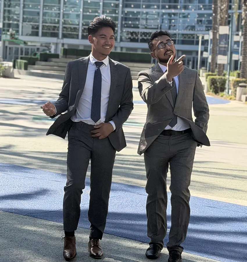 Two AIM Solutions professionals discussing brand visibility strategies